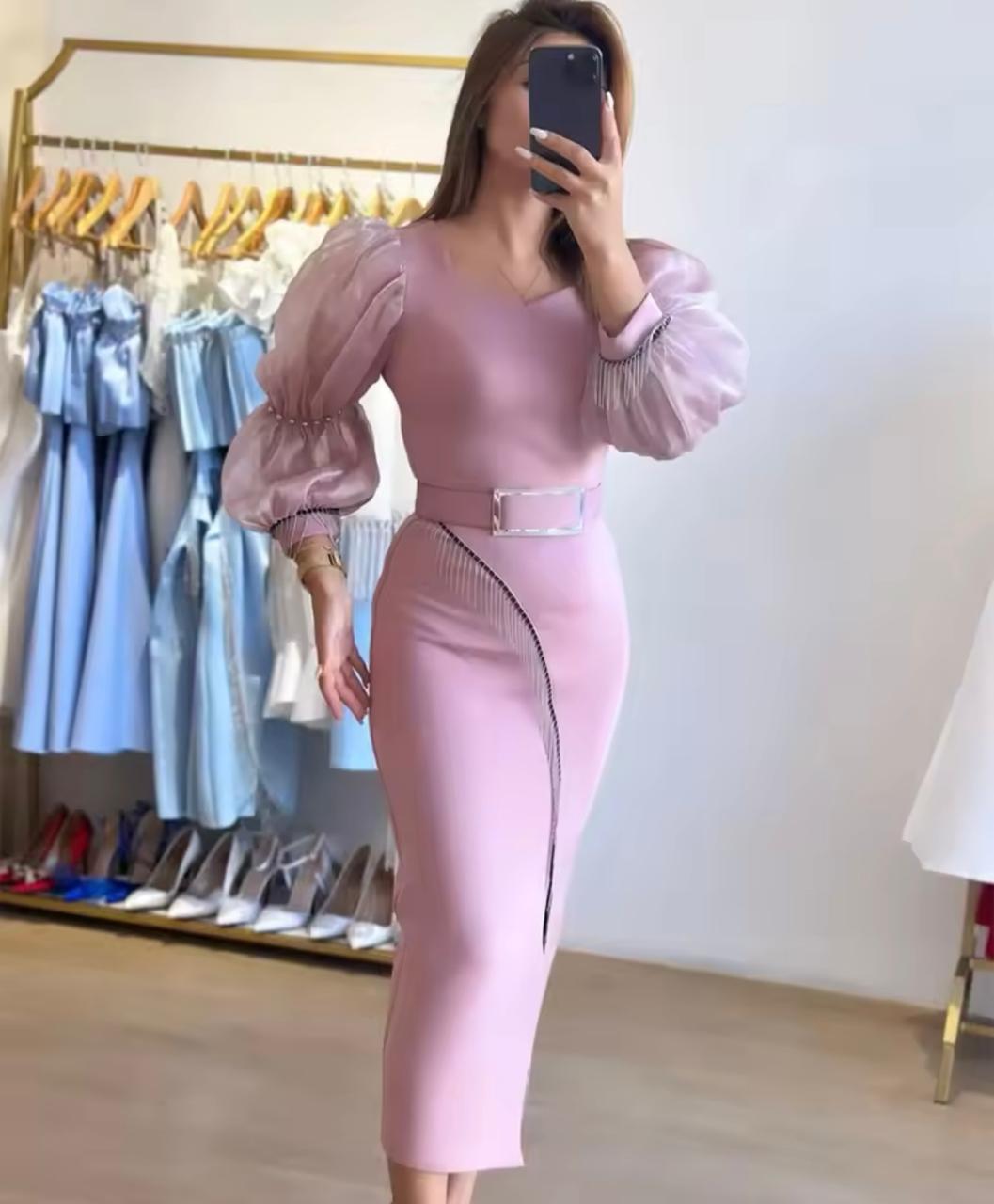 Elegant pink midi dress with statement sleeves and embellished details